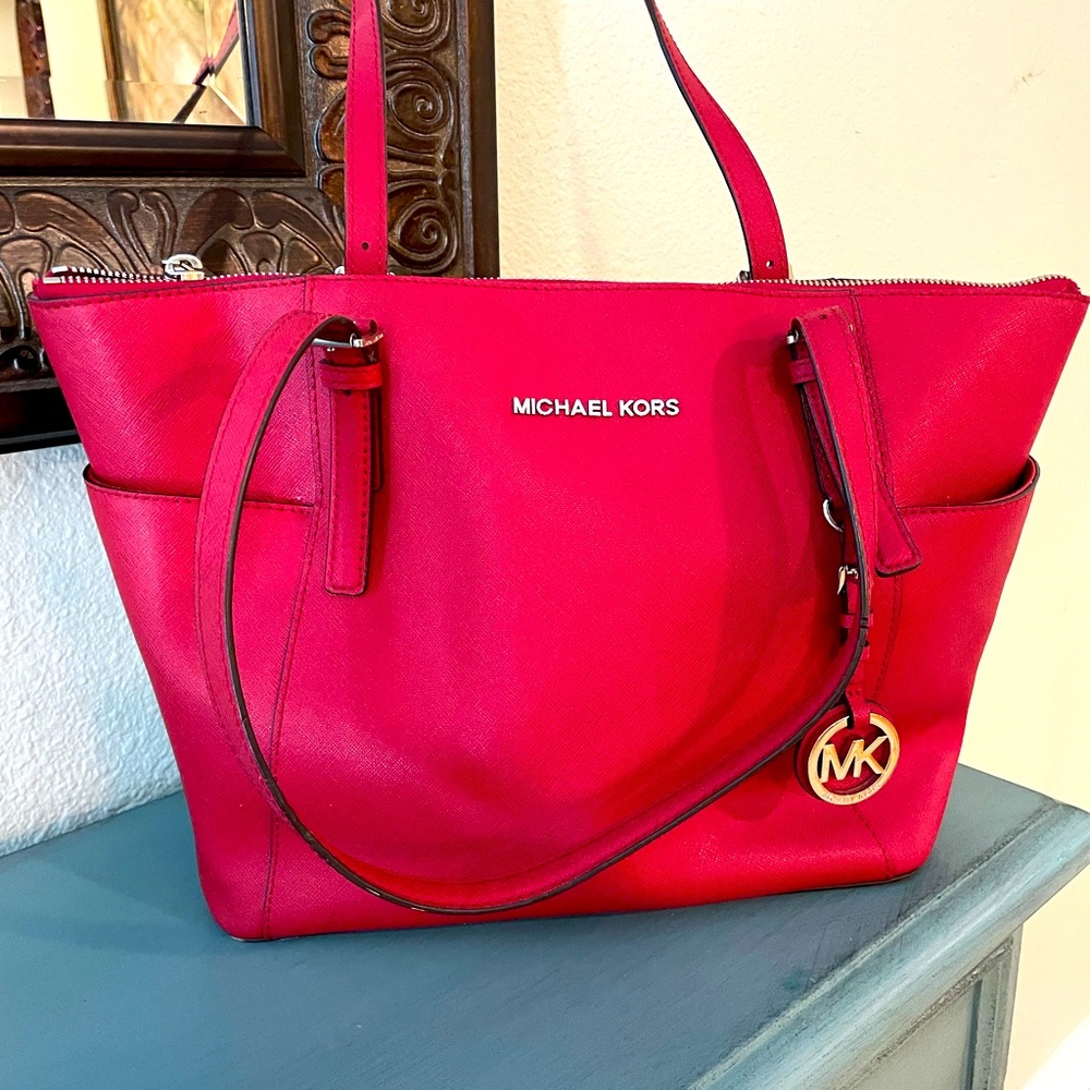 Michael Kors red handbag.